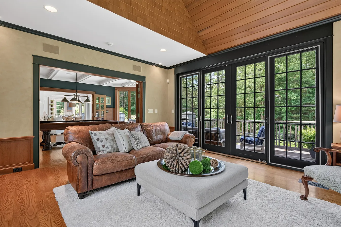 Wood window trim and built-in bench framing the great room windows