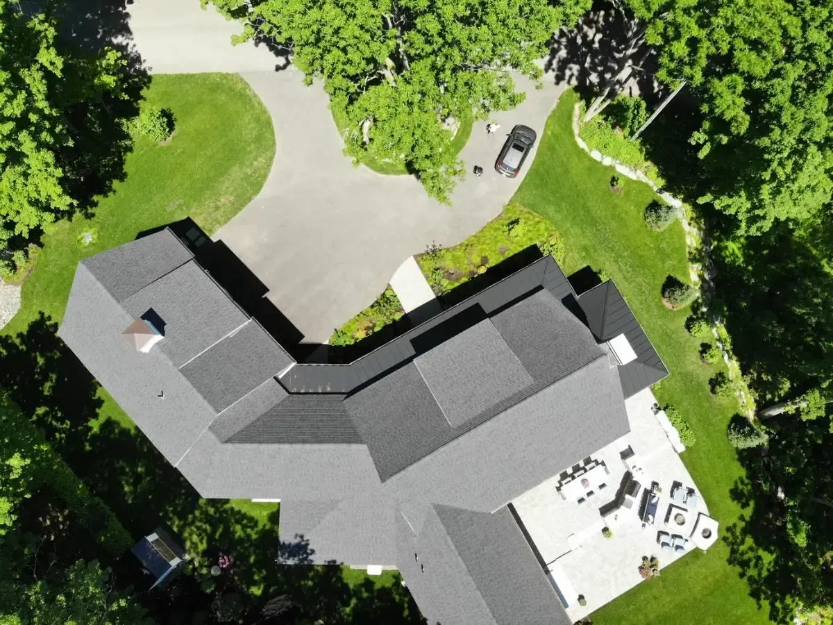 Cape cottage and car in the driveway, viewed from above