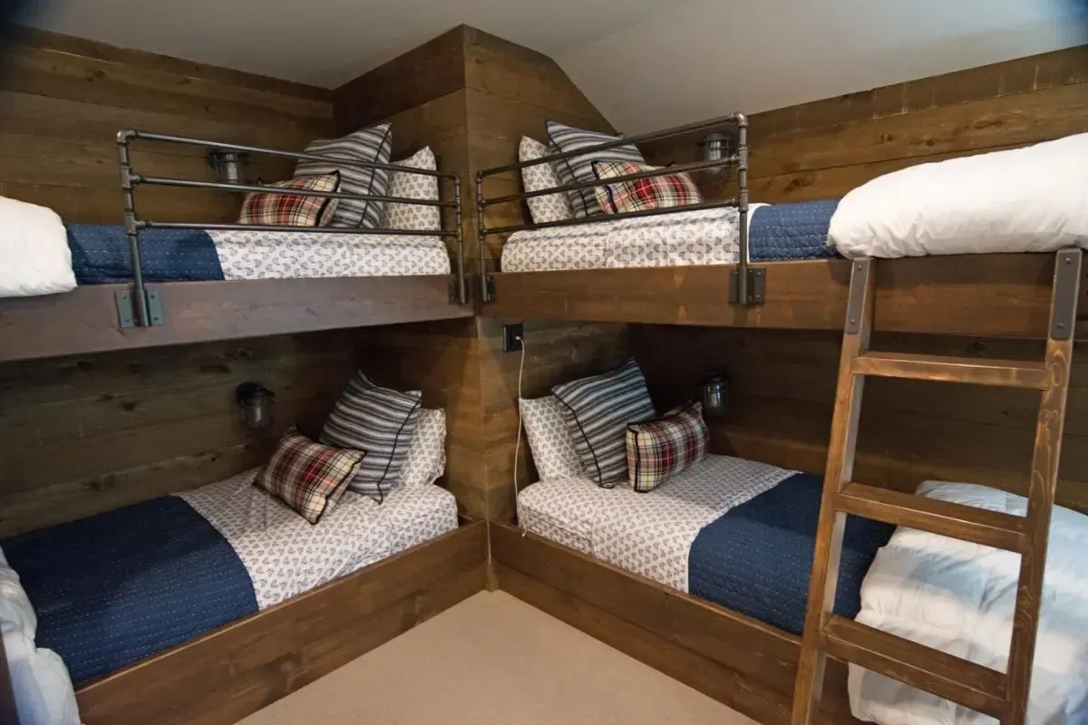 Four built-in bunk beds with a central ladder