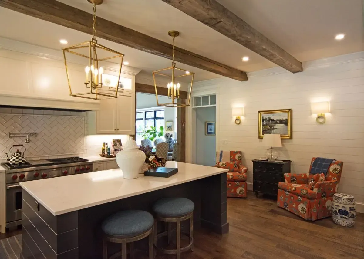 Large kitchen island beneath the ceiling lights