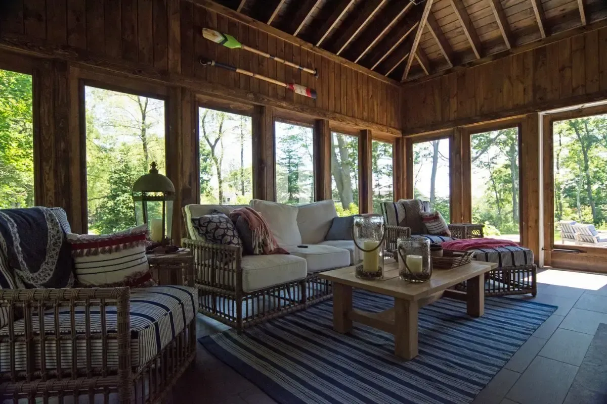 Living room with broad windows and a furnished seating area