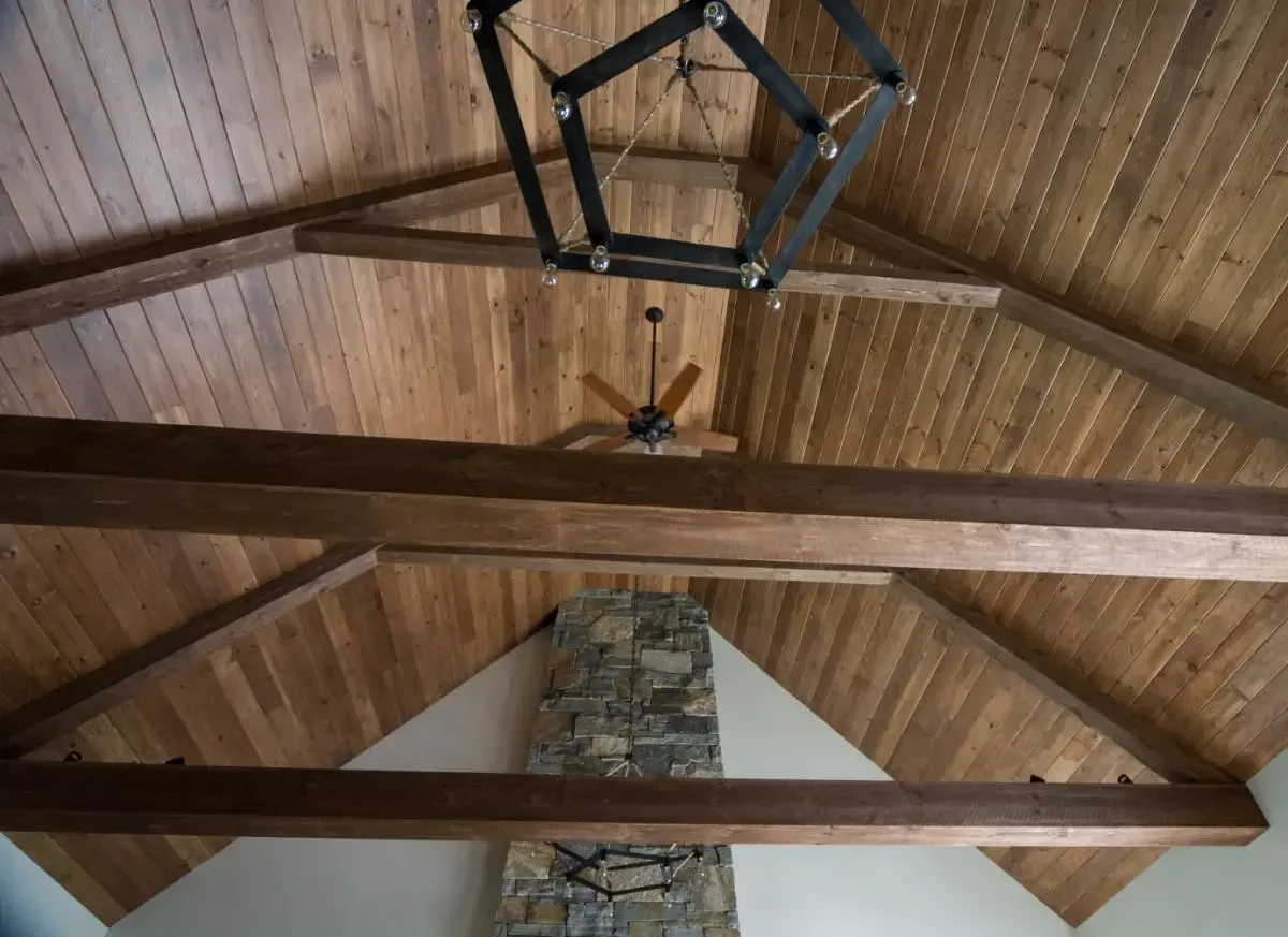 Wood ceiling beams and a ceiling fan