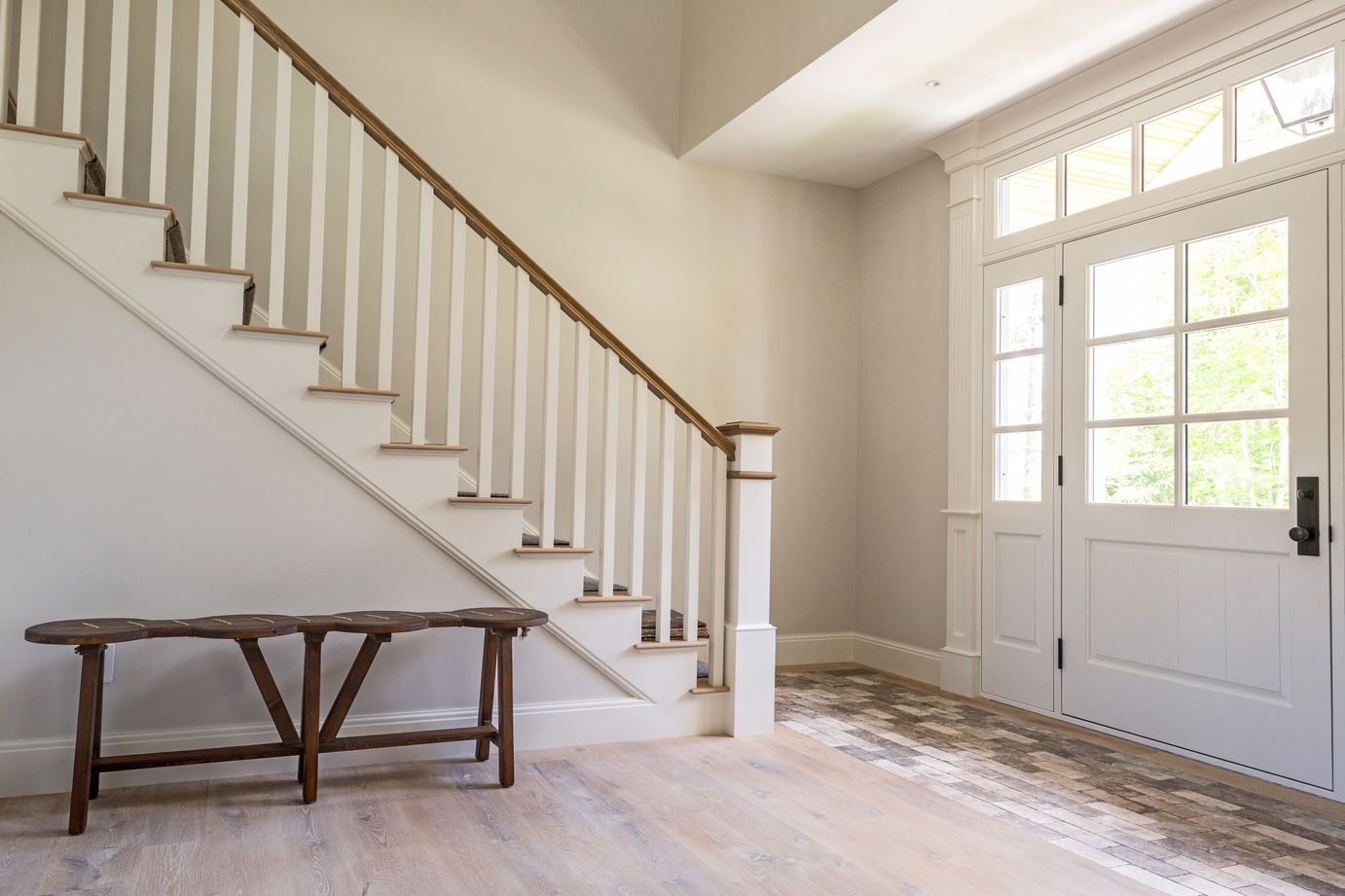 Built-in bench tucked beneath the staircase