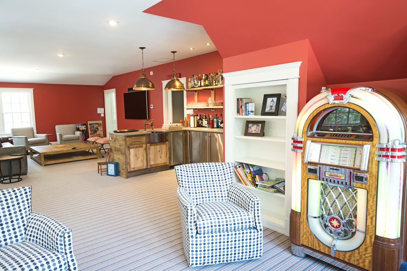 Living room with red walls and a jukebox