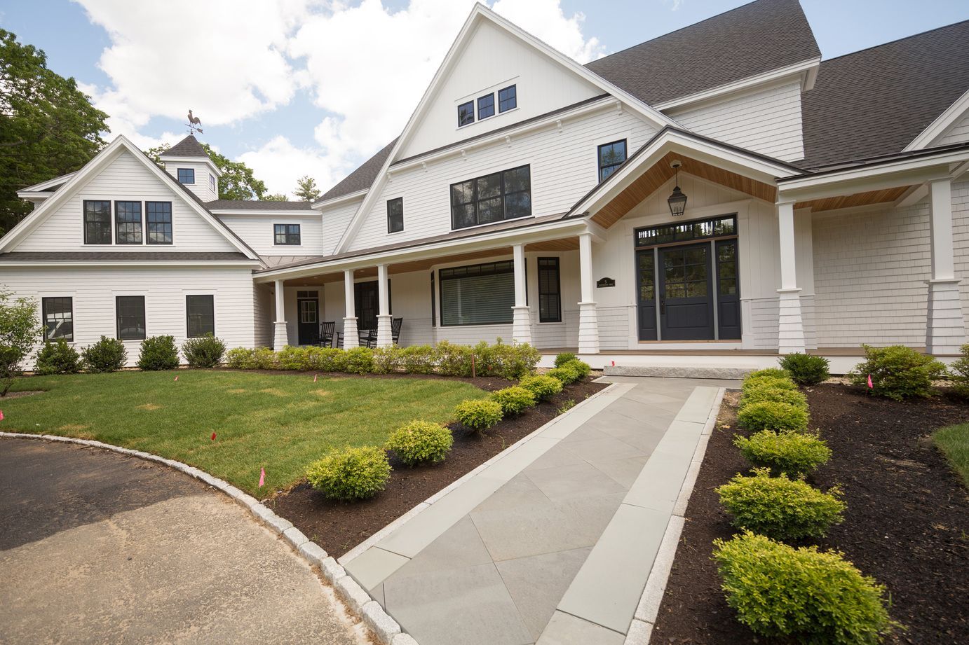 White Cape Elizabeth Colonial with a front walkway