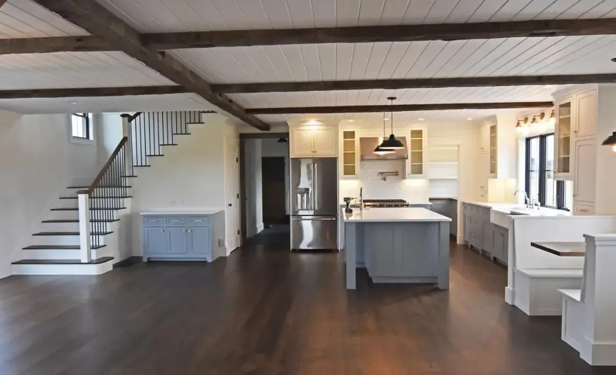 Kitchen with a staircase leading to the upper floor