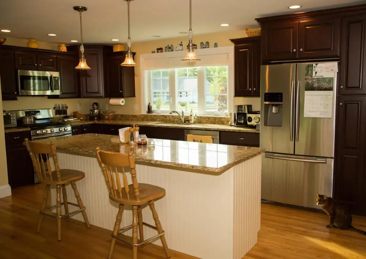 Kitchen with wood cabinetry and stainless-steel appliances