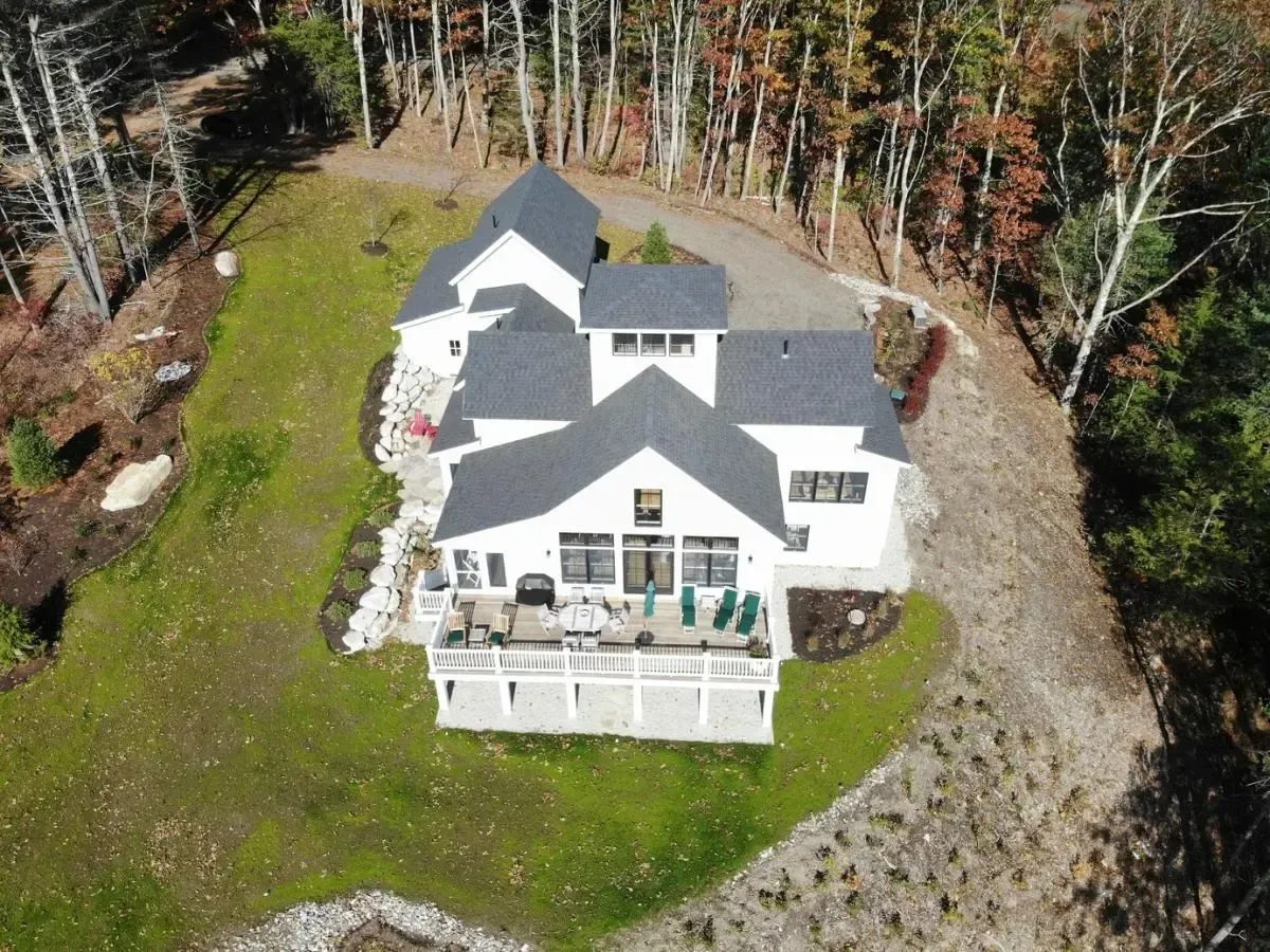 Aerial view of the Cumberland cottage among mature trees