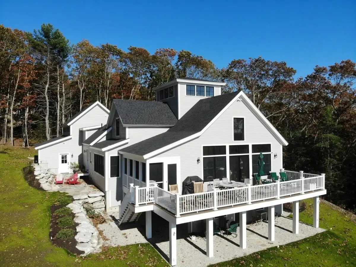 Aerial view of the Cumberland home and deck among trees
