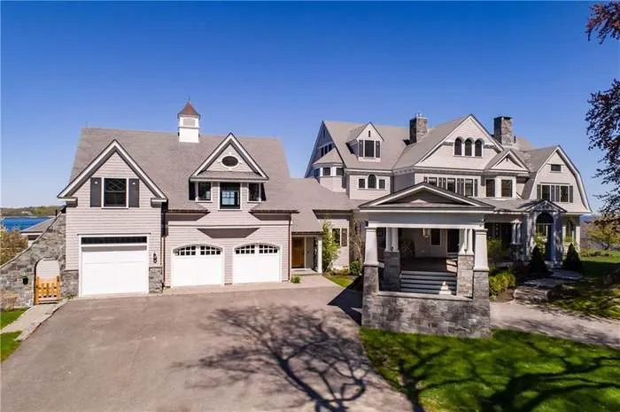 Shingle-style coastal residence viewed from the front approach