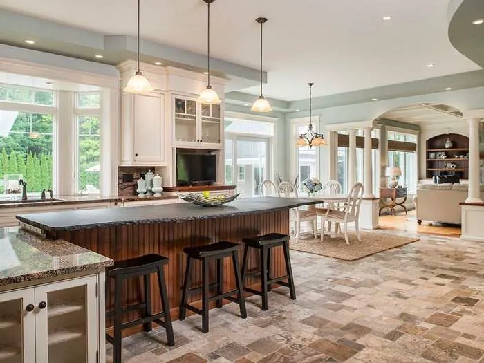 Kitchen with custom cabinetry and a broad island