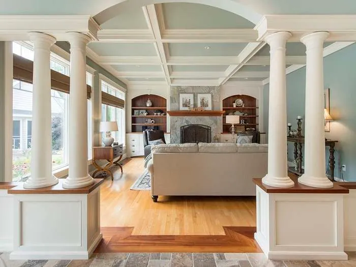 Living room with a fireplace and arched doorway