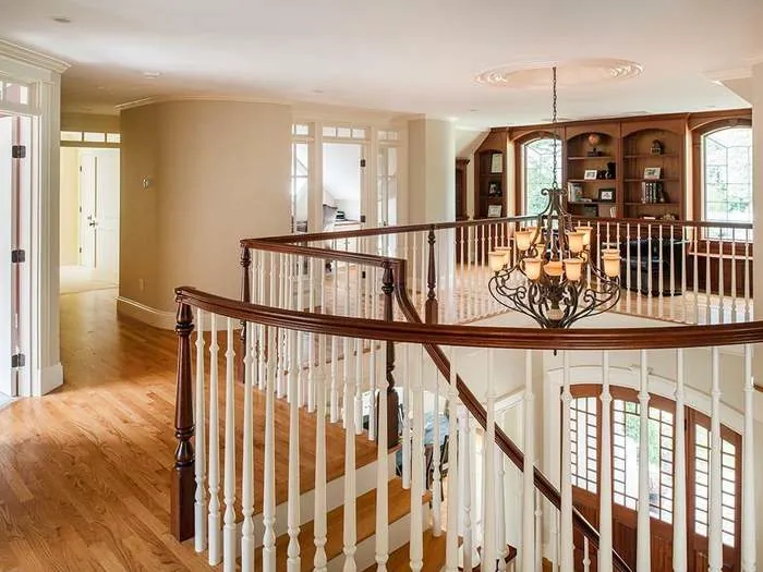 Guest bedroom with wood floors and classic trim