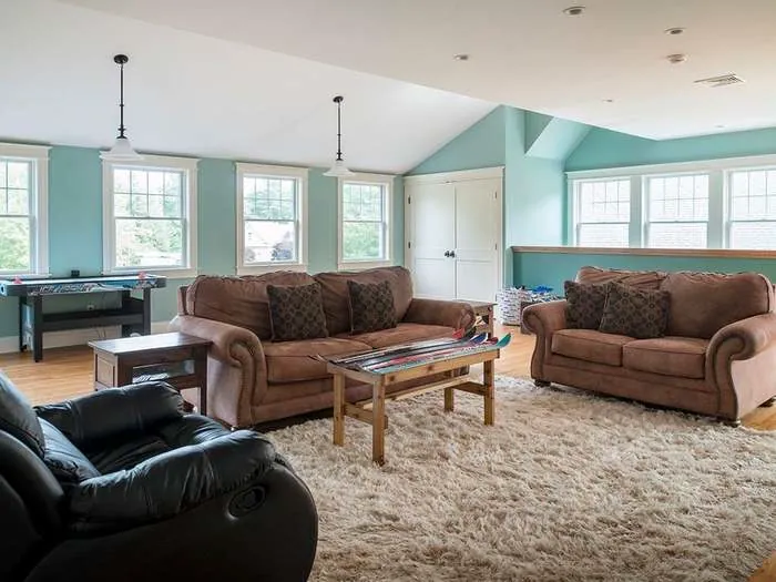 Family room with painted walls and wood flooring