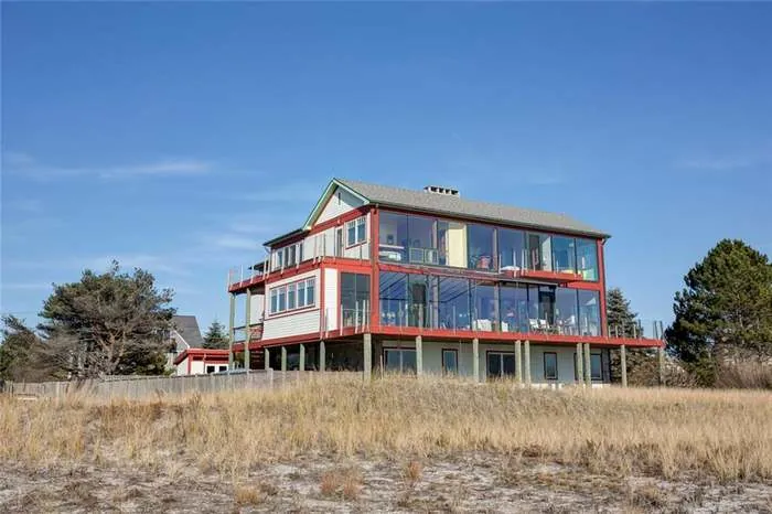 Pine Point Beach home viewed from the side across the coastal grass