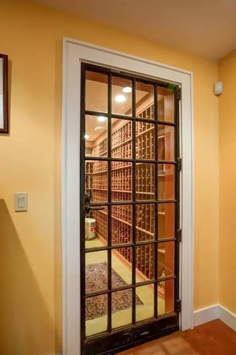 Interior passage with glass doors and warm wood details