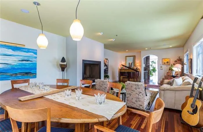Open dining and living room with expansive coastal views