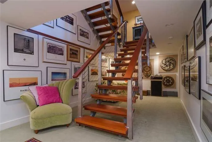 Interior staircase with wood treads and framed artwork