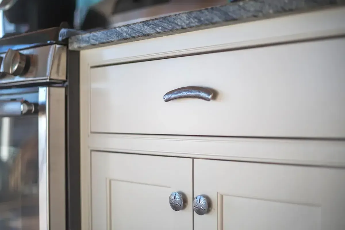 Kitchen cabinetry beside the range