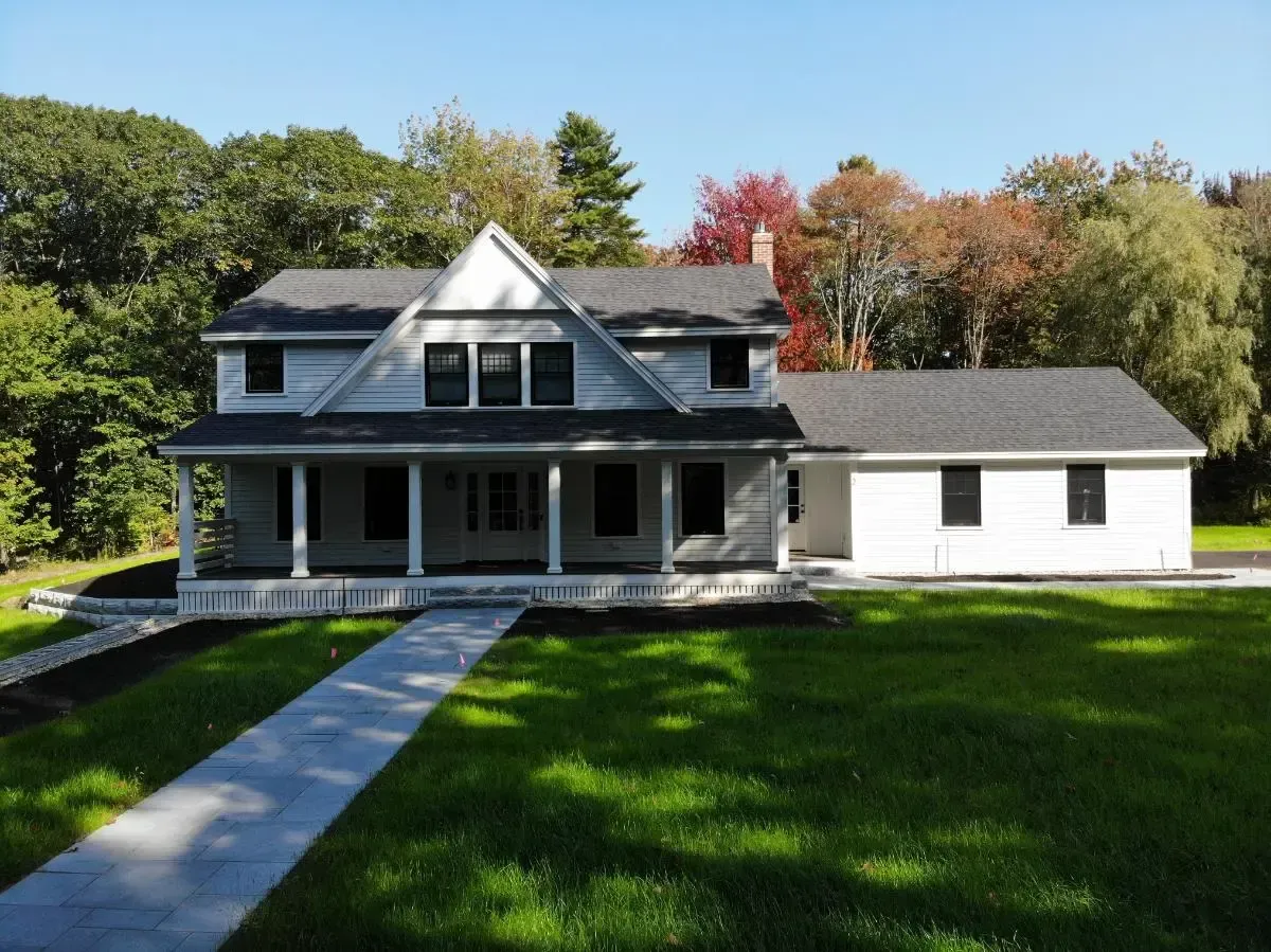 Renovated home with a porch and a walkway