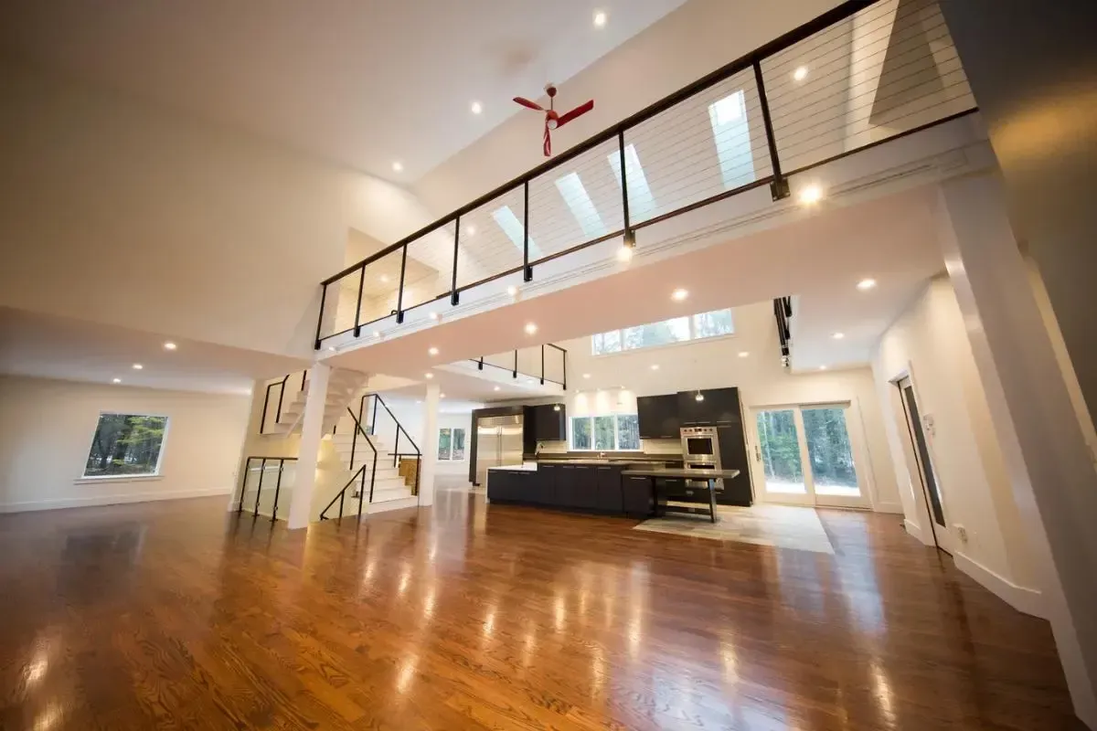 Unfurnished room with hardwood floors and a balcony