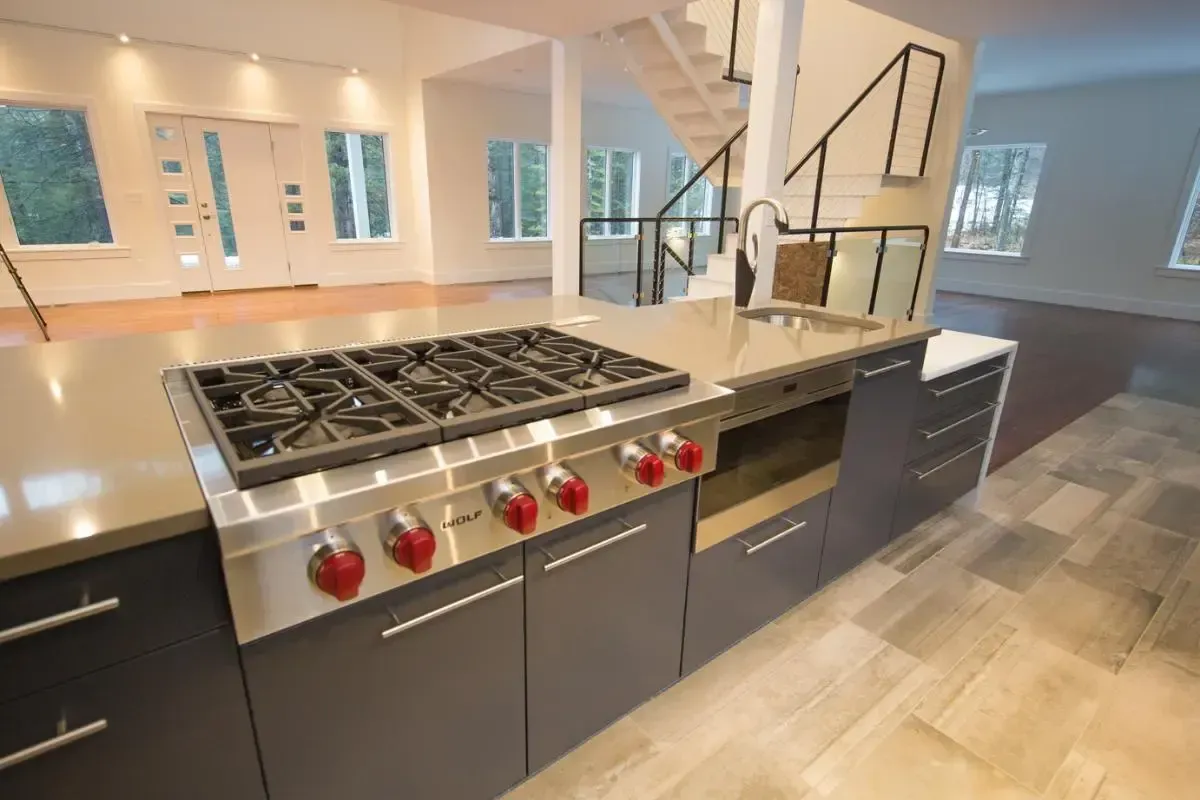 Kitchen with a cooktop, oven, and sink