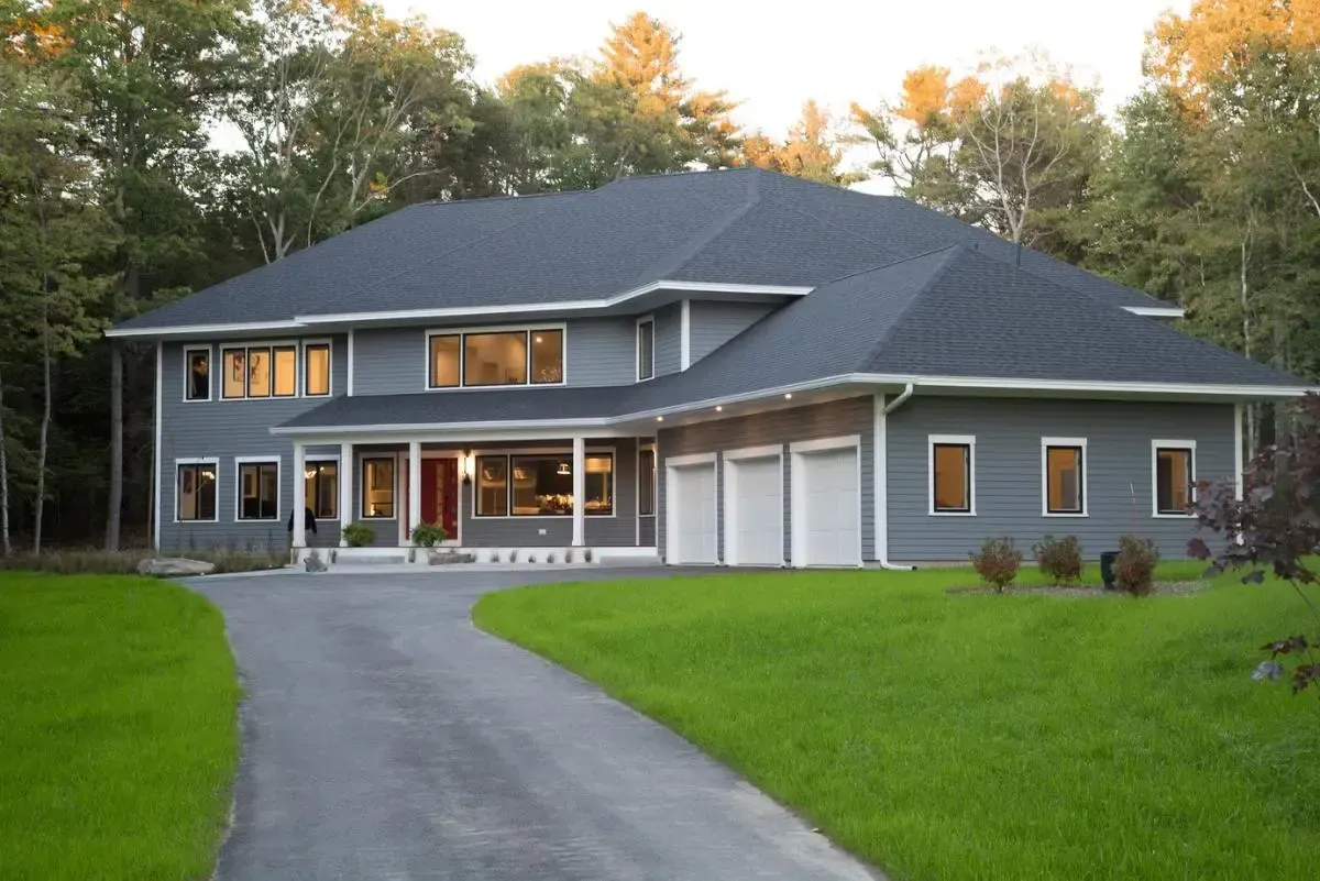 Modern custom home in Falmouth, Maine, approached from the driveway
