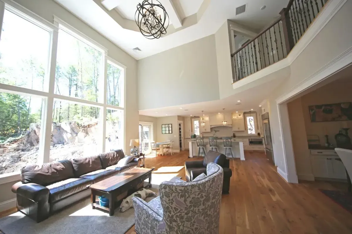 Living room with sofa seating and broad windows