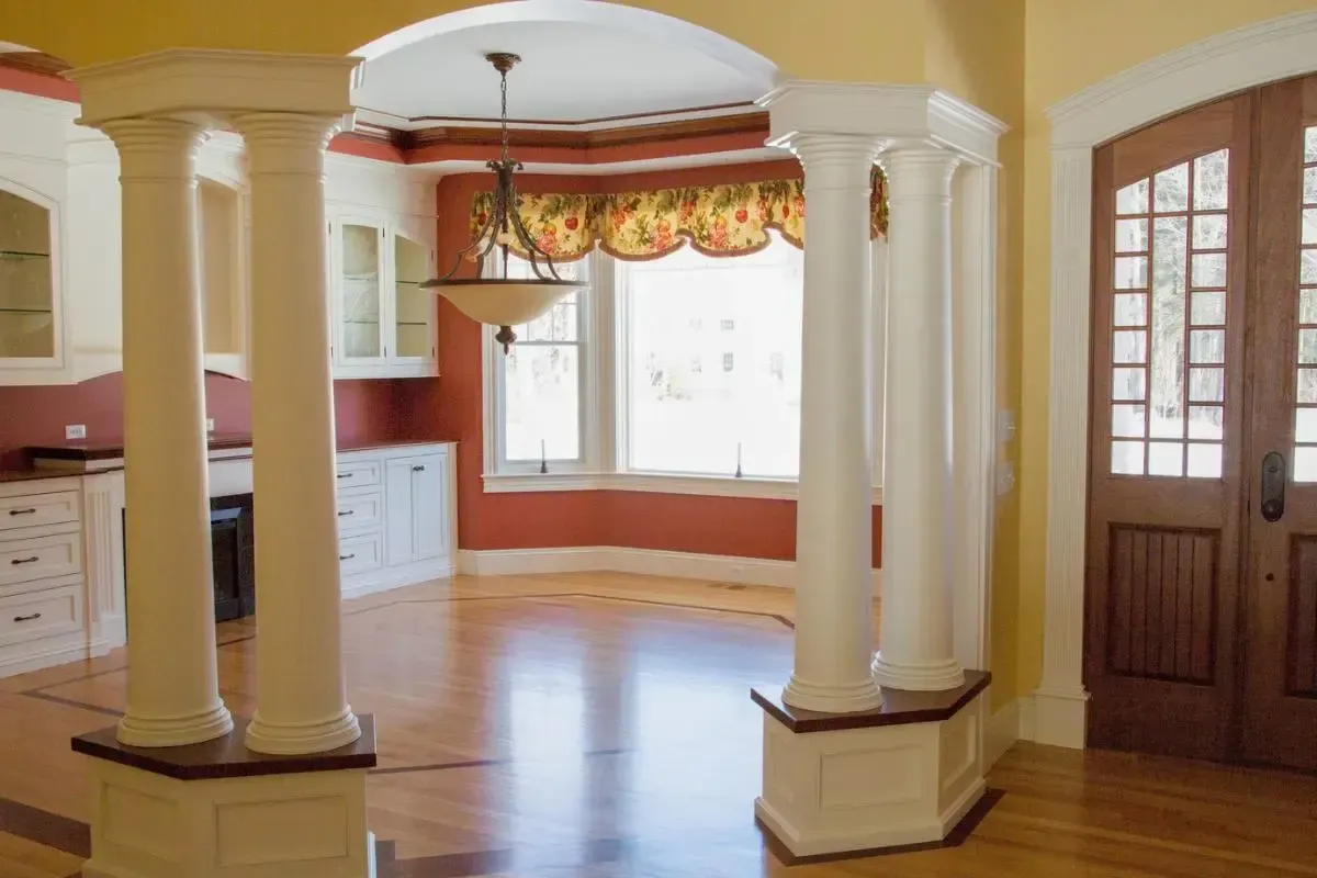 Room with interior columns and a large window