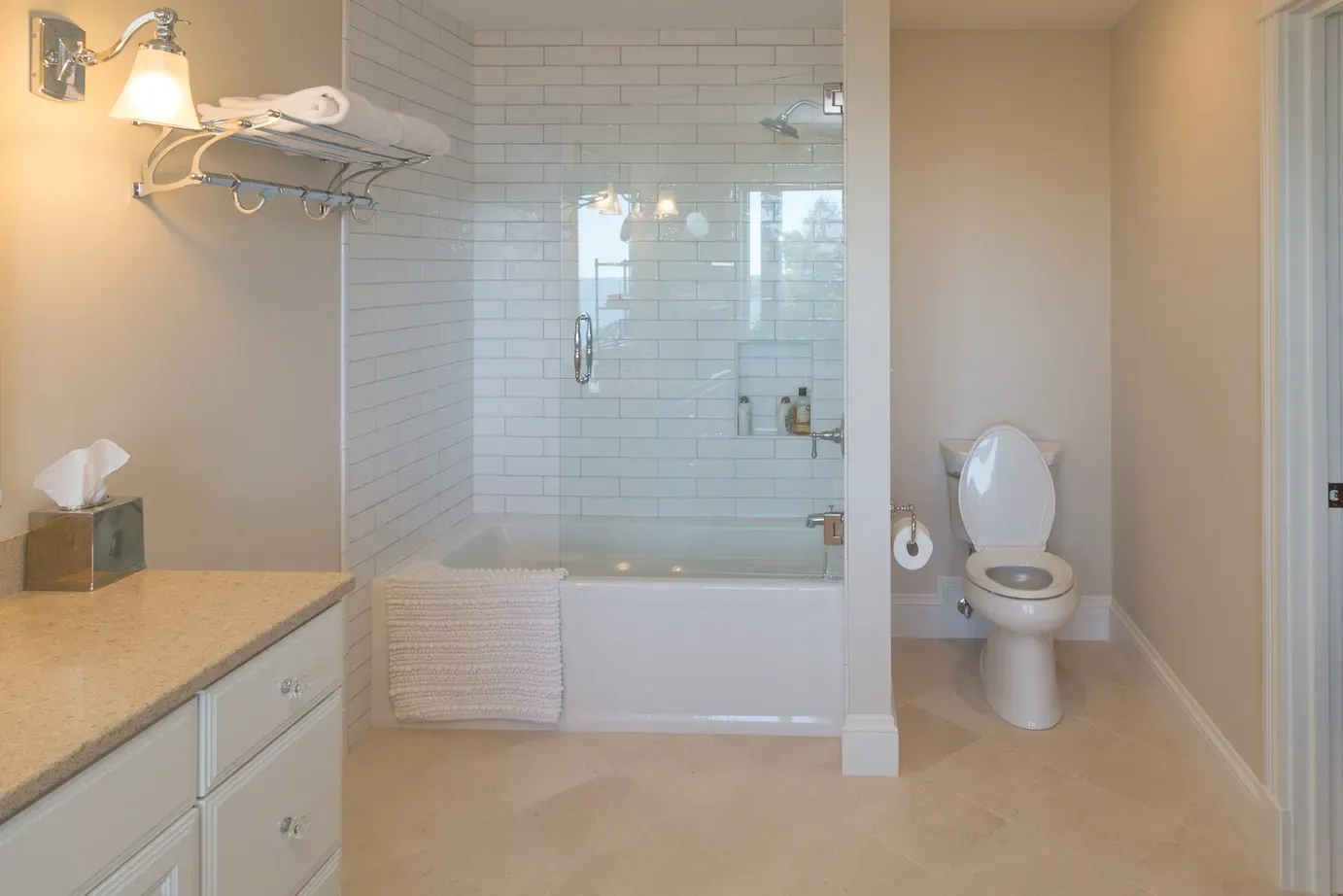 Bathroom with a bathtub, shower, and toilet