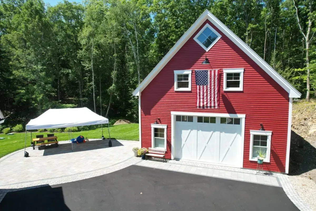 Red barn topped with an American flag