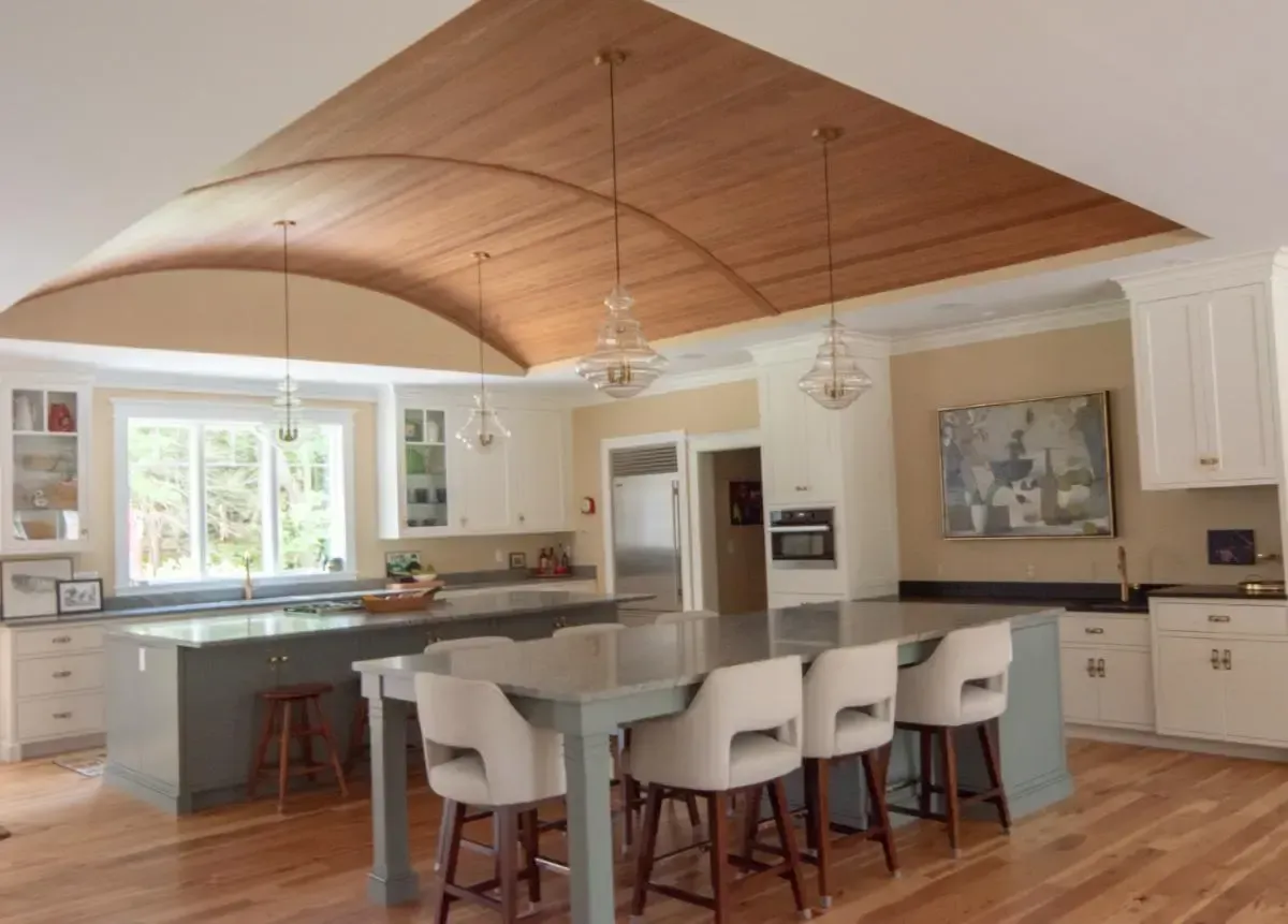 Custom kitchen with a curved ceiling and a large island in the Shore Road home