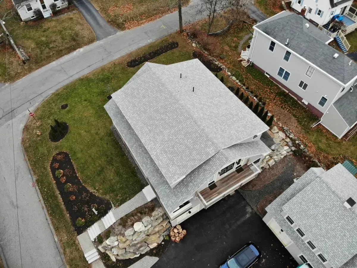 Aerial view of the South Portland cottage and gray roof