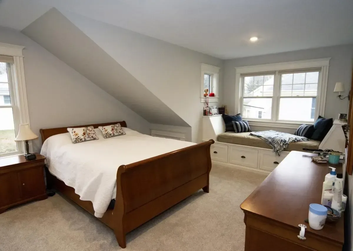 Bedroom with a sleigh bed and built-in window seat