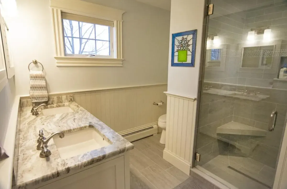 Bathroom with a sink, toilet, and shower