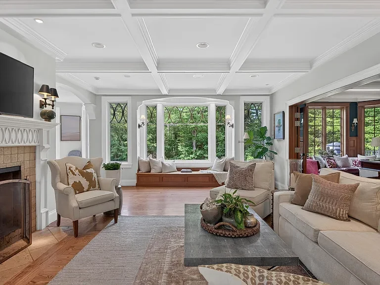 Coffered ceiling, custom built-ins, and a window seat in a Cape Elizabeth residence