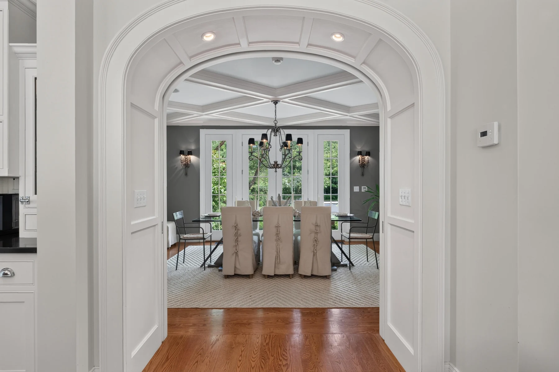 Arched opening connecting the hall to the formal dining room