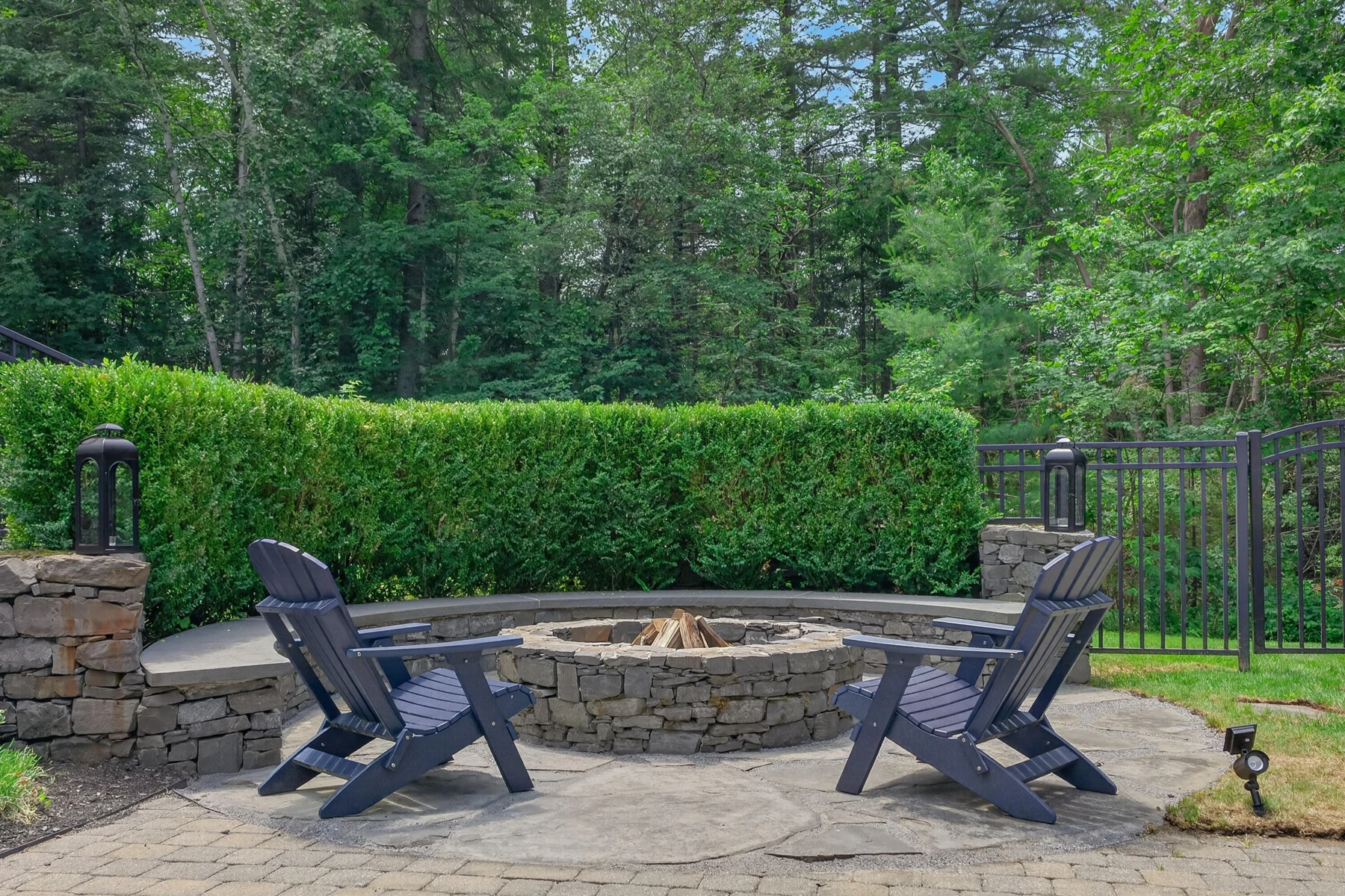 Stone firepit and seating on the garden terrace