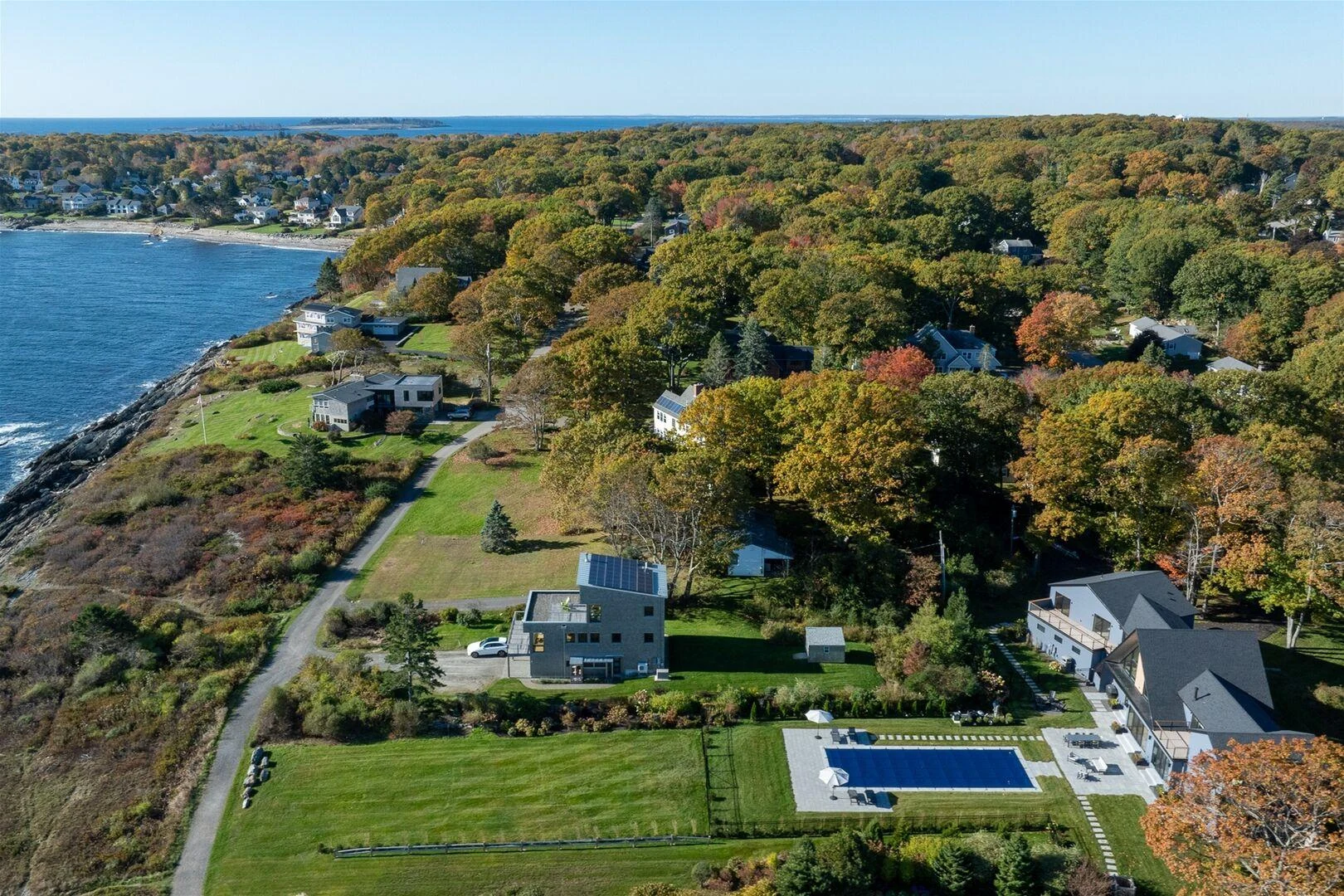 Aerial view along the Trundy Point shoreline with the residence and pool below