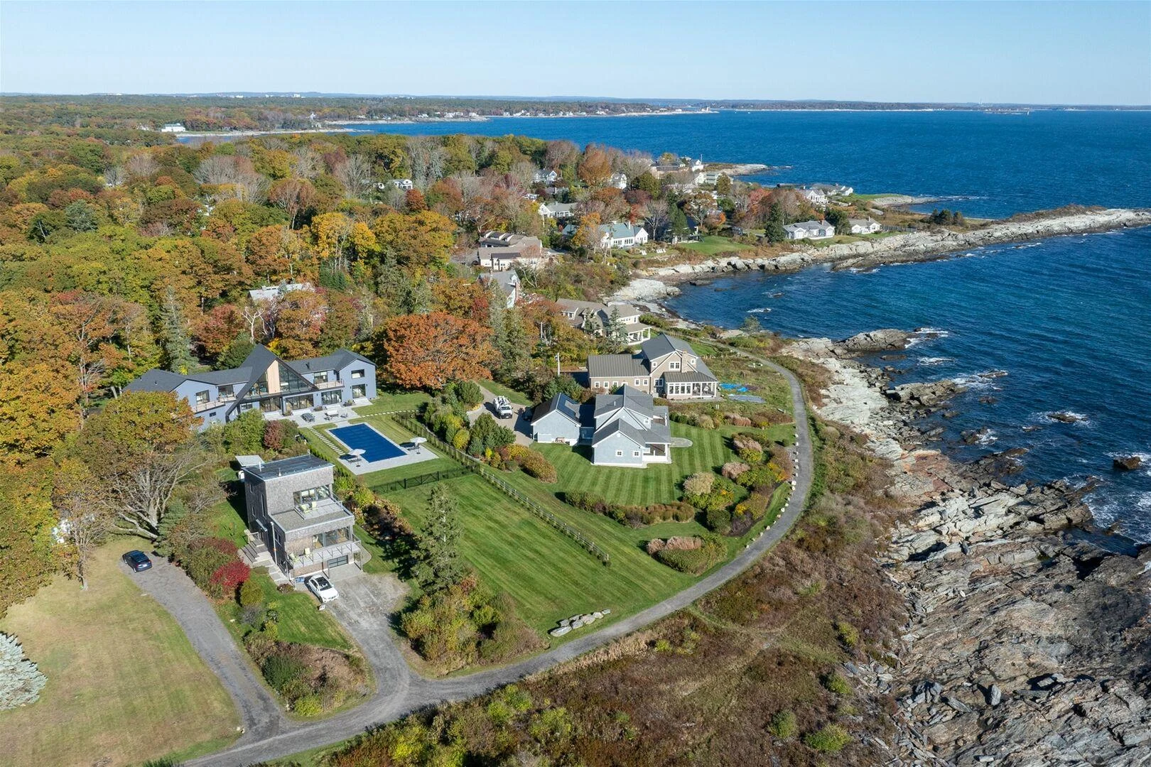 Waterfront side of the Trundy Point residence with its lawn and swimming pool